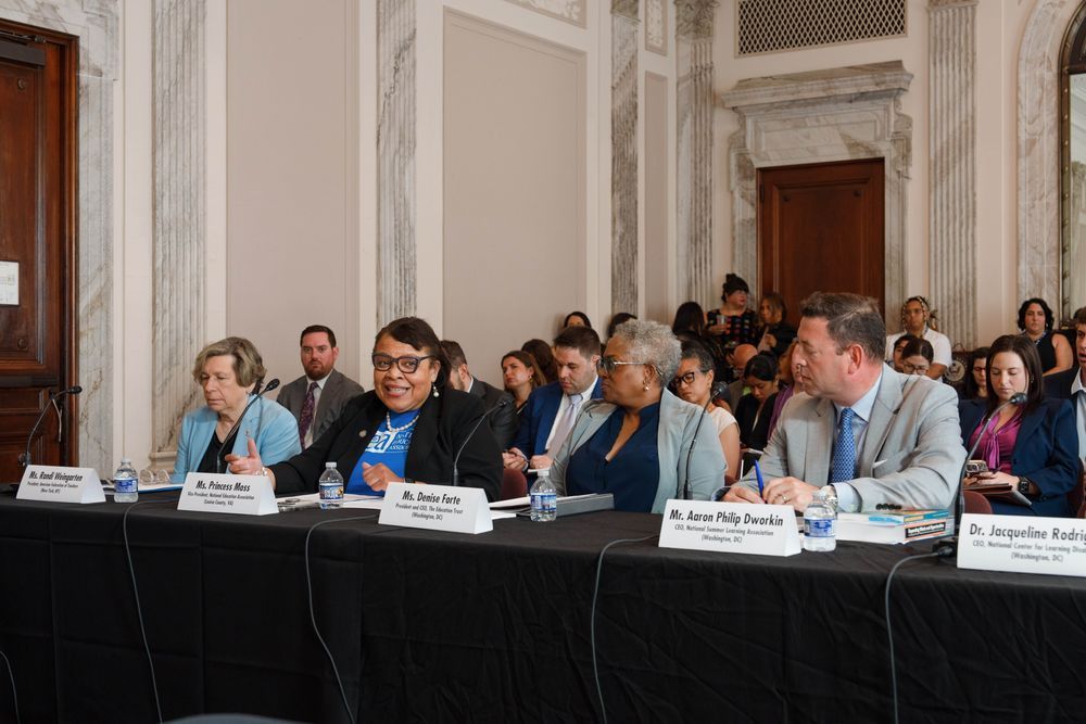 Image of NEA Vice President Princess Moss speaking at Senator Hirono's Capitol Hill forum in Washington, DC next to Randi Weingarten, Denise Forte, Aaron Philip Dworkin, and Jacqueline Rodriguez.