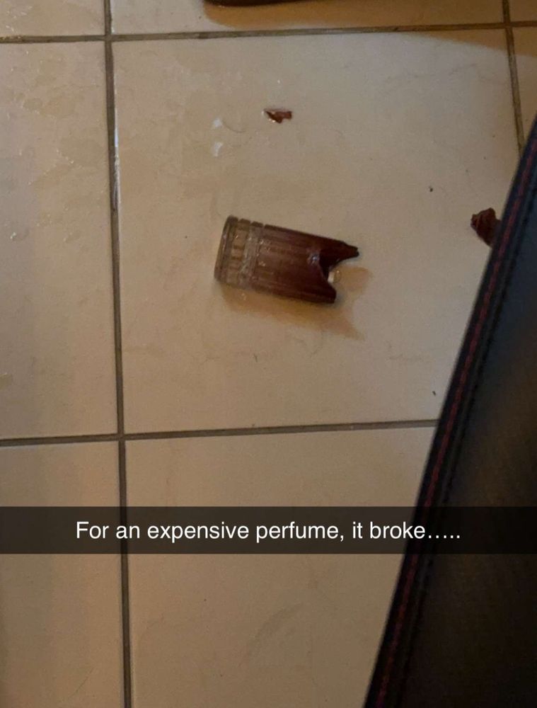 A photo of a broken bottle of perfume