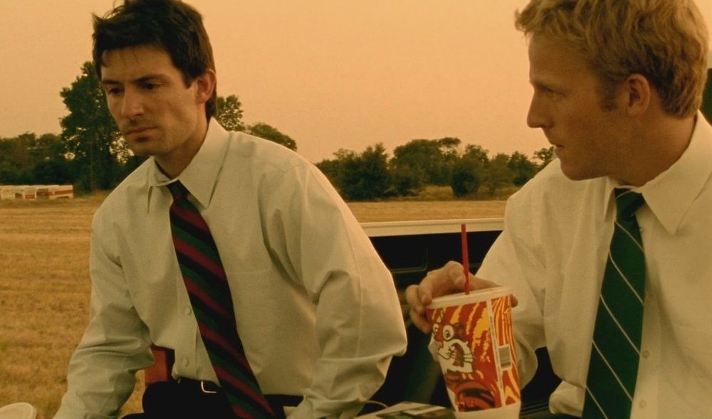 Primer (2004) frame of Aaron and Abe outside drinking soda