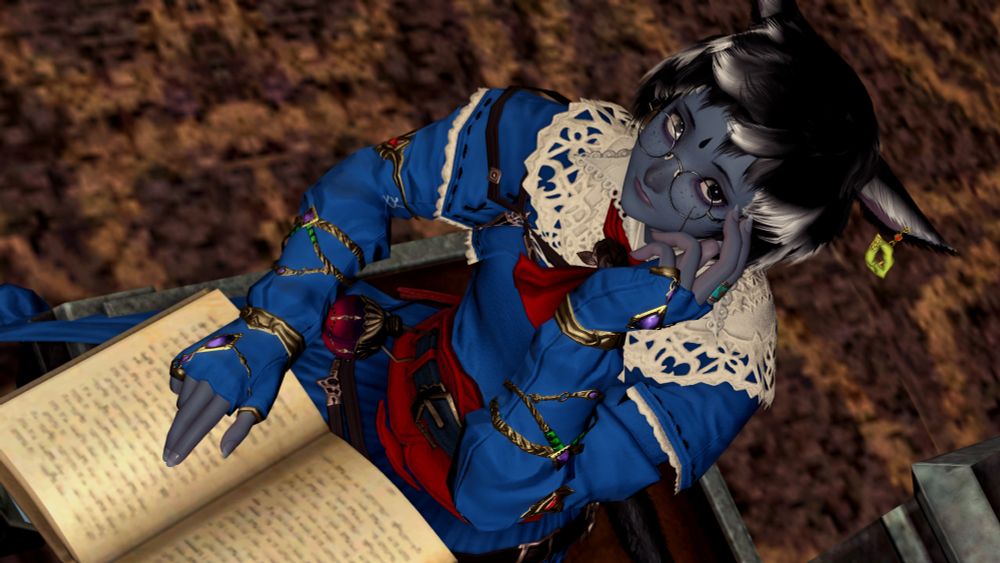Pieh sitting down with a book, looking up and adjusting her glasses.