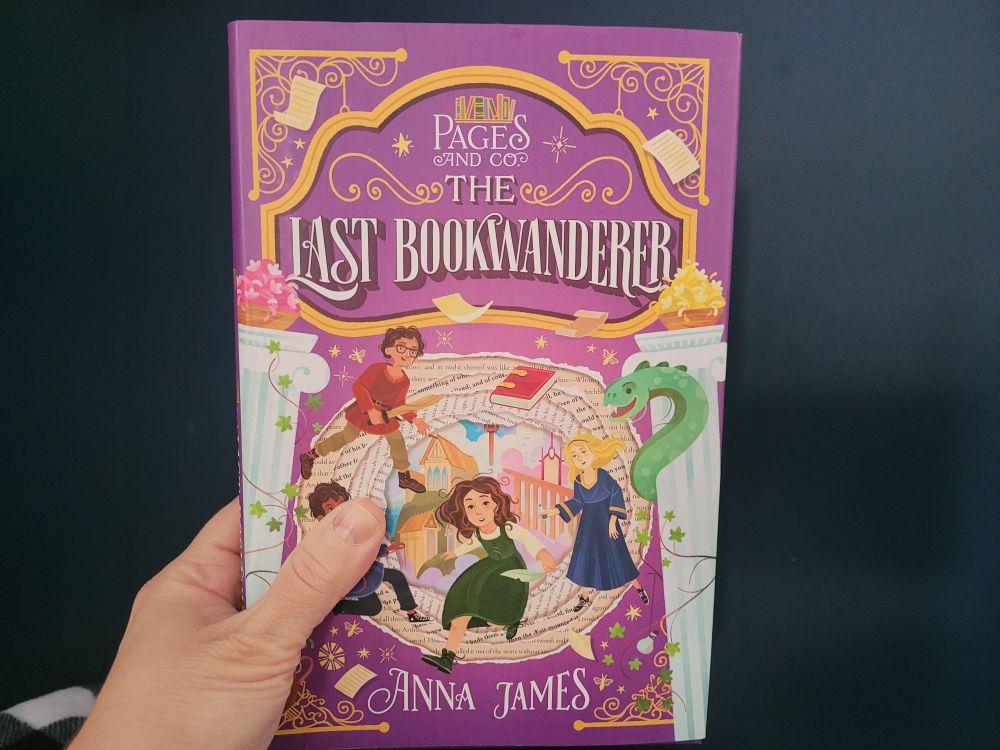 Cover of the book The Last Book Wanderers, shoeing children who appear caught in a magical world with flying books and a dragon.