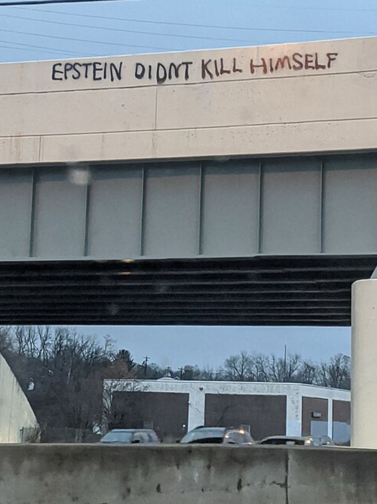 Graffiti featuring the phrase on an overpass on Interstate 71 in Cincinnati
