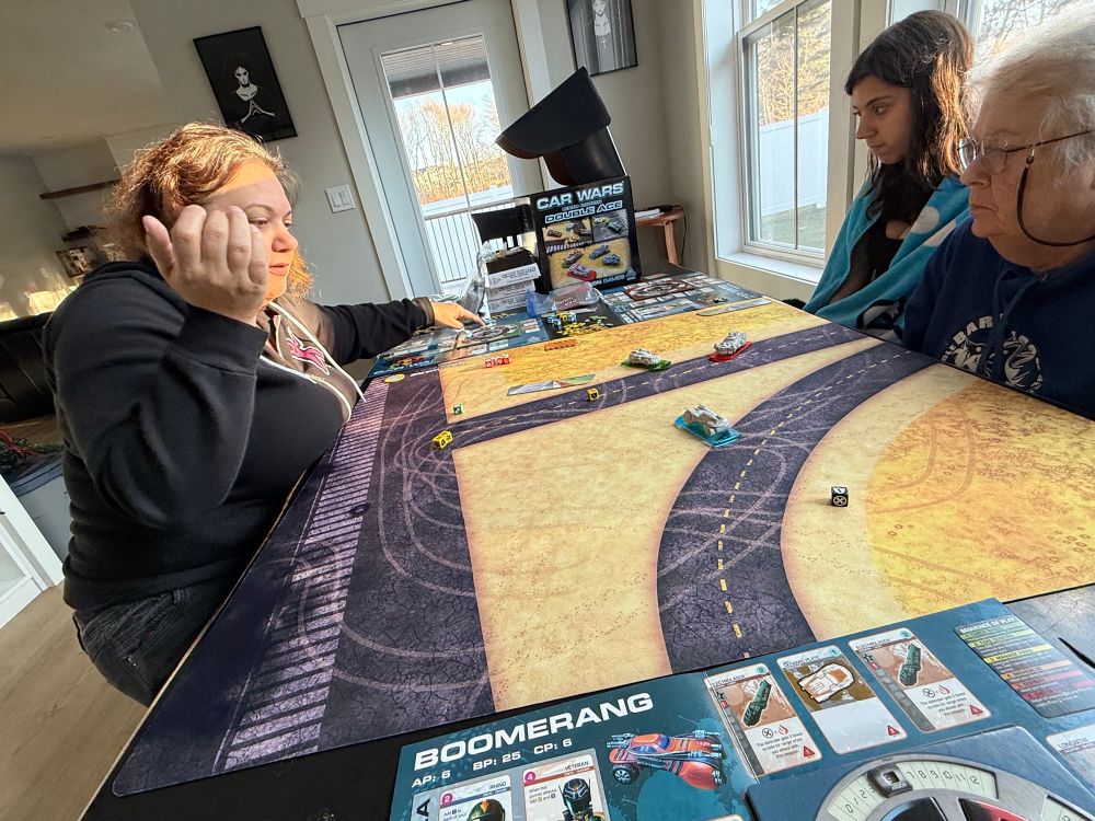 Grandma (right) 'helps' The Cardboard Kid in Car Wars 6e, but it's unnecessary. The Kid's won every game she's played. Mom (left) is in the process of rolling dice.