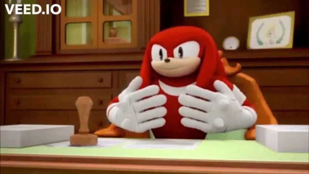 knuckles the echidna from sonic the hedgehog is sitting at a desk with his hands on his chest