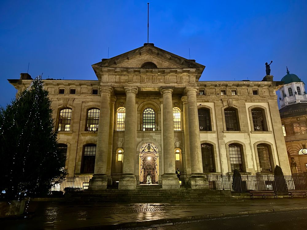 Clarendon building lot up and with a Christmas tree outside