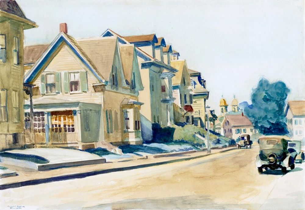 2/3 storey wooden houses on left side of the street, some 1920's black cars travelling away down the road