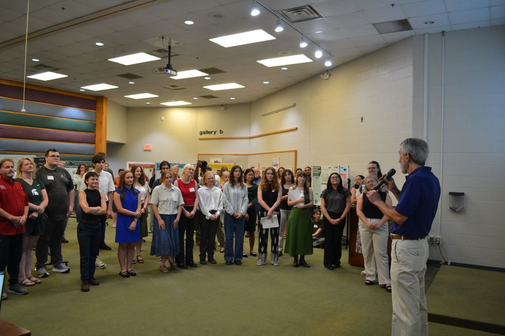 2025 summer undergraduate students listen to remarks at the beginning of the Summer Research Symposium.