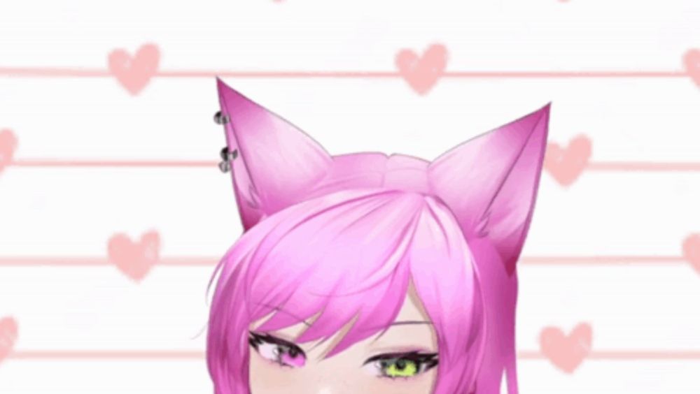 a girl with pink hair and cat ears looks at the camera with hearts in the background