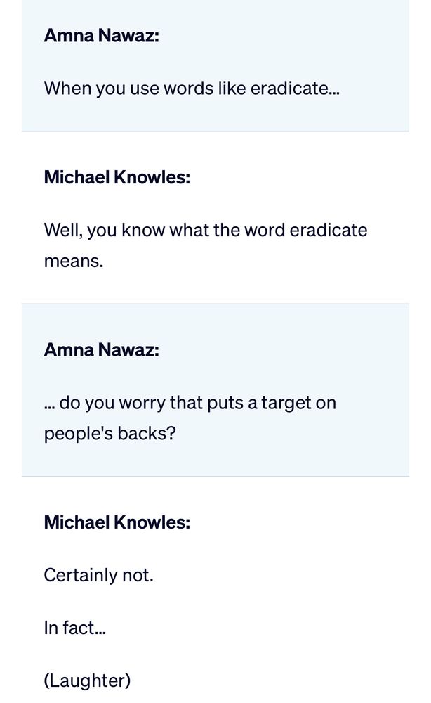 A continuation of the PBS NewsHour transcript showing an exchange between Amna Nawaz and Michael Knowles. Nawaz asks about Knowles’ use of the word “eradicate,” questioning whether it puts a target on people’s backs. Knowles responds, “Well, you know what the word eradicate means,” followed by Nawaz pressing further on the potential harm of such language. Knowles dismisses the concern with “Certainly not,” and the transcript ends with “(Laughter).”