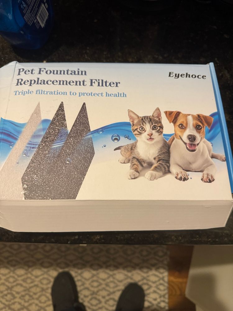 Box of pet water filters with a fake brand name.