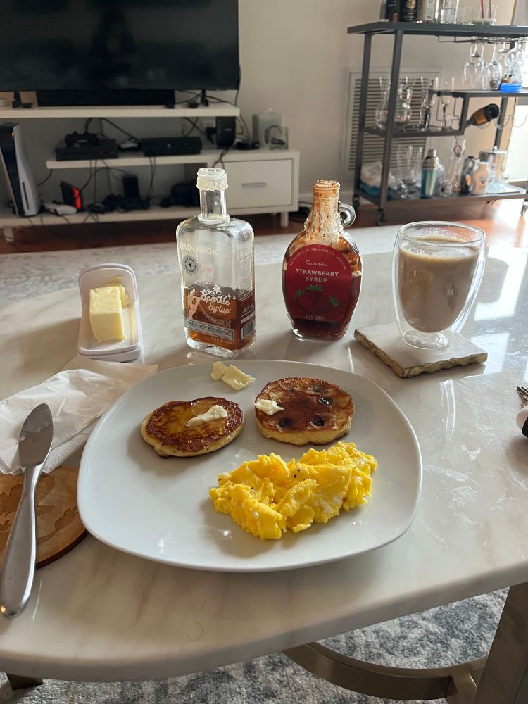 Pancakes, scrambled eggs, coffee.