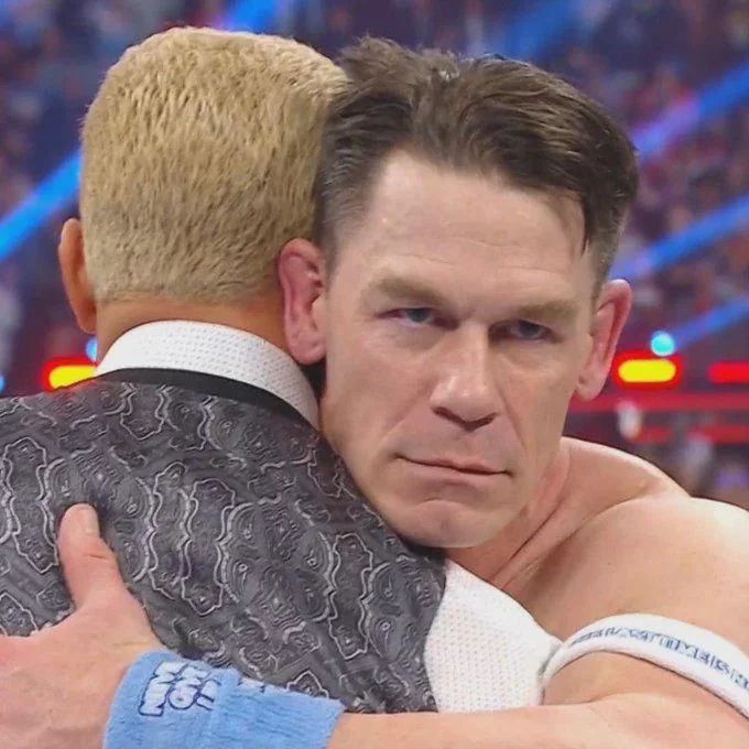 John Cena hugging Cody Rhodes moments before betraying him.