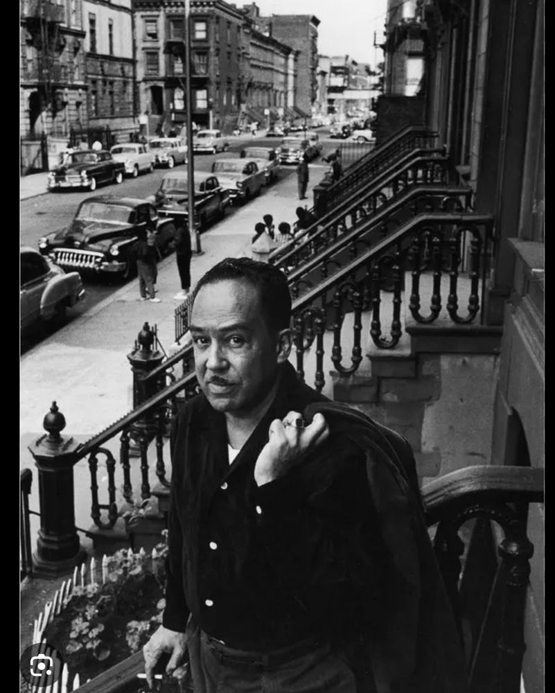 Langston Hughes on his steps in Harlem