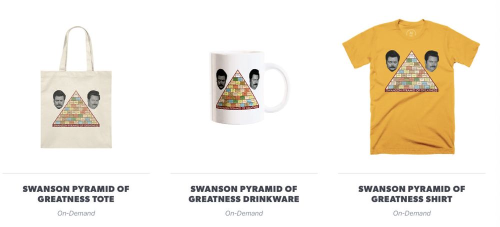 Image showcasing three items featuring the &ldquo;Swanson Pyramid of Greatness&rdquo; design. On the left, a tote bag with a pyramid graphic and two faces above it. In the center, a white mug with the same pyramid and faces. On the right, an orange T-shirt with the pyramid and faces. Each item is labeled with its name and &ldquo;On-Demand&rdquo; below.