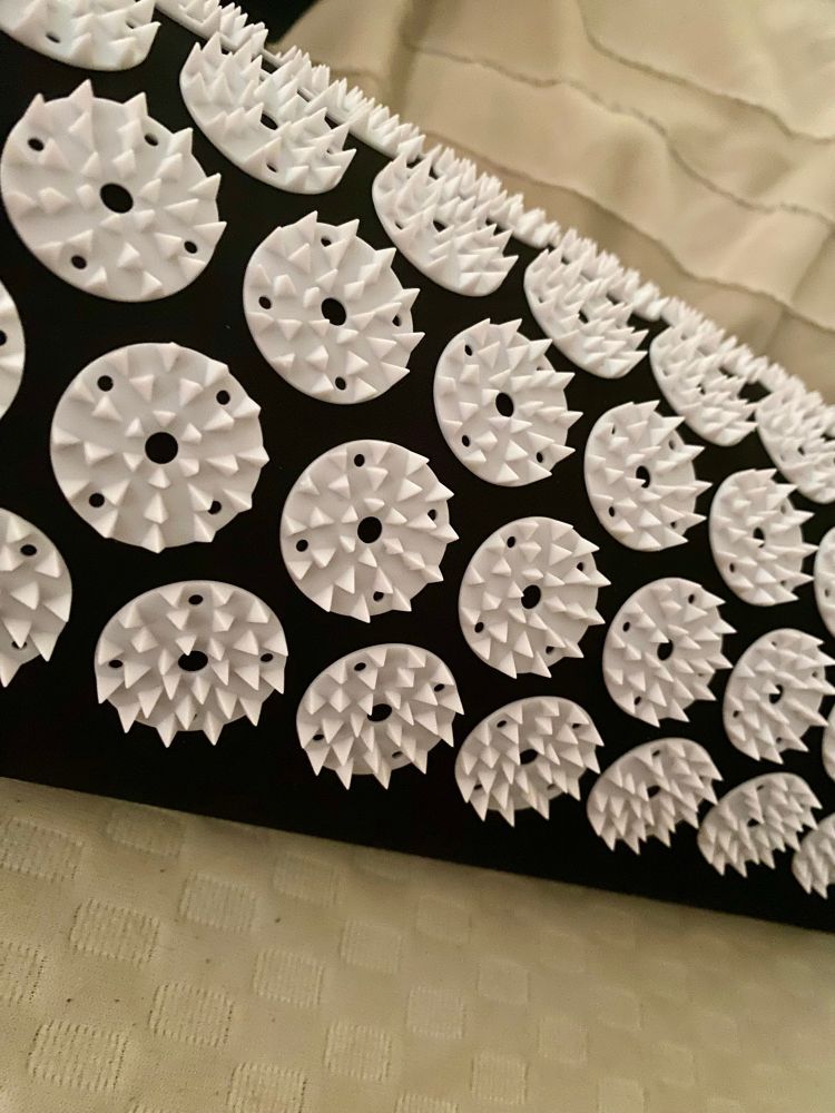an acupressure pillow with spiked discs 