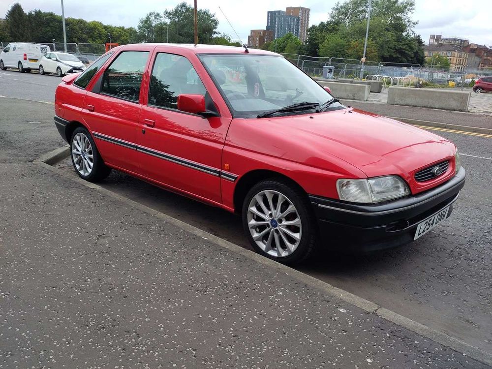 A red Ford Escort LX from 1994