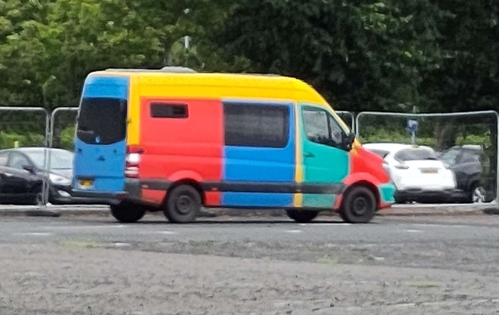 A van thats been given a colour scheme similar to the VW Harlekins. Each panel is painted in one of four colours, a red, green, yellow or blue.