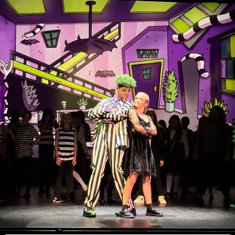 Academy Youth Theatre - Beetlejuice Jr Background  | Beetlejuice and Lydia standing in living room that's been transformed.