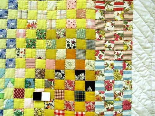 Square patchwork quilt made of scraps 