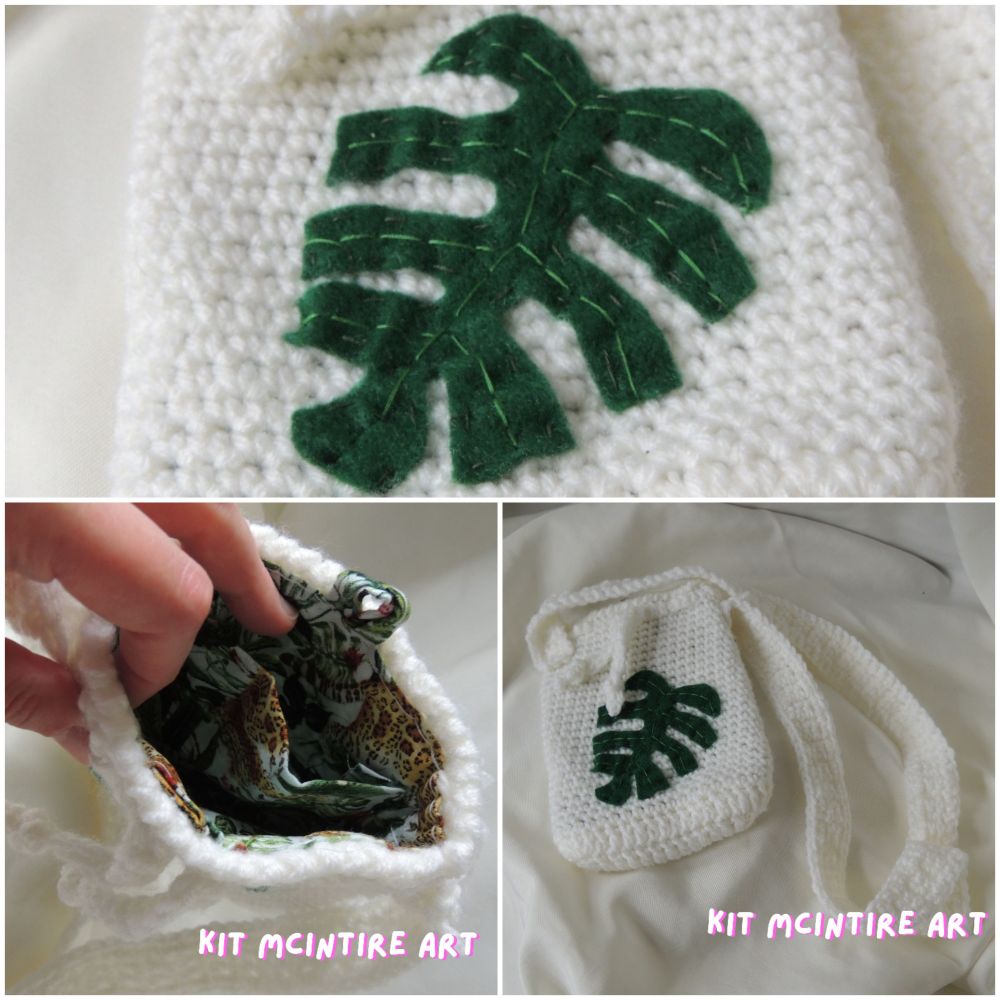A small crochet bag with a felt monstera leaf stitched to the front. The inside of the bag is lined with jungle themed fabric.