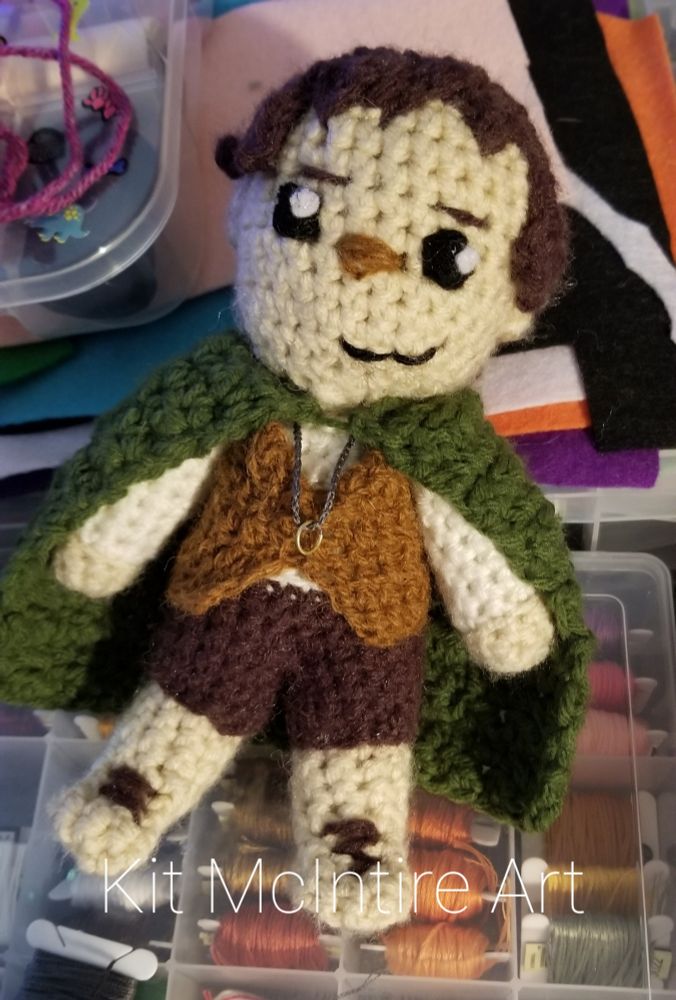 A crochet plush inspired by Frodo from Lord of the Rings