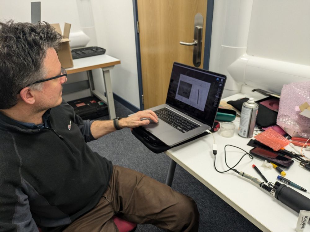 Lab set-up, with Alex taking an holographic image of hair. 