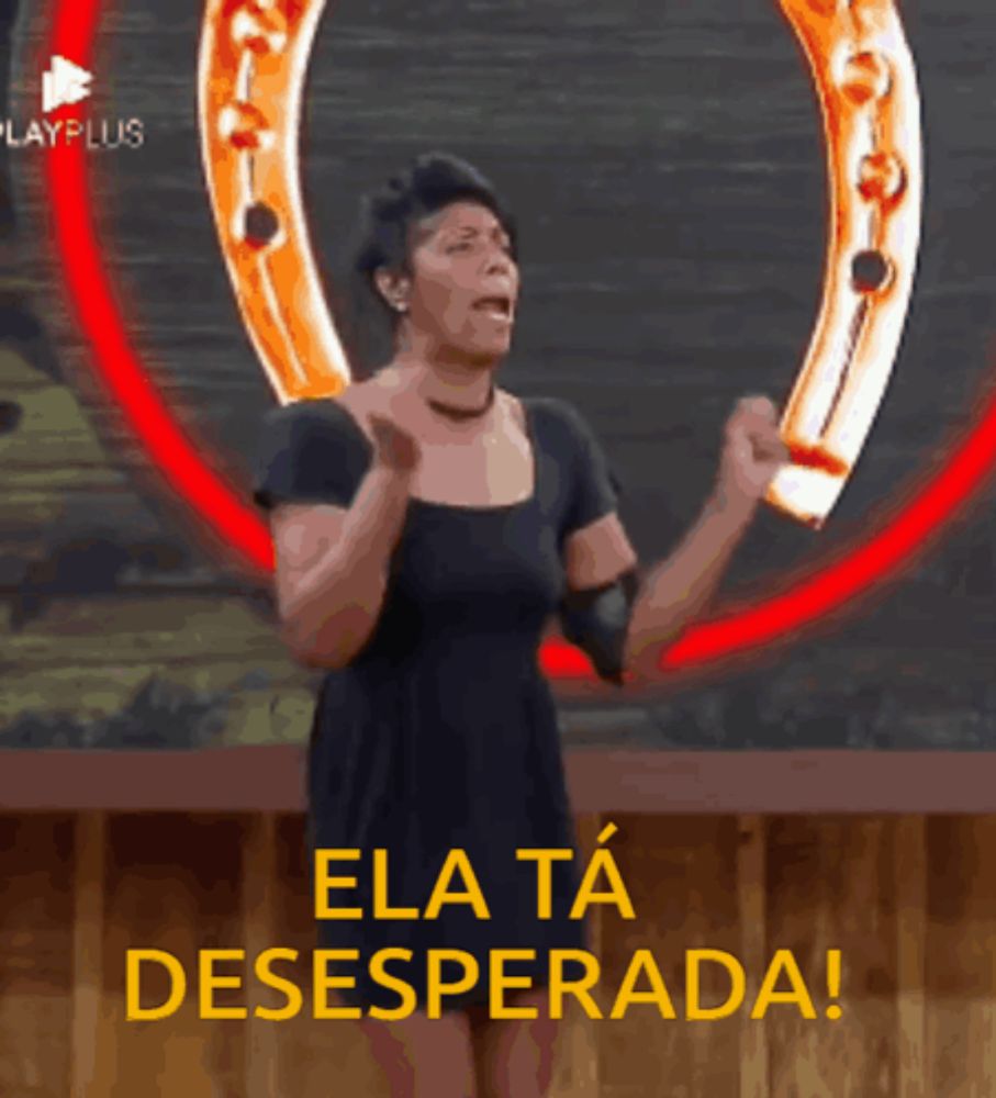 a woman in a black dress is dancing in front of a horseshoe and the words ela ta desesperada