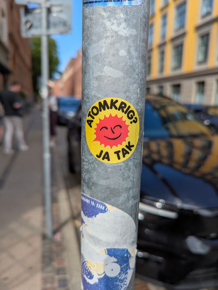 The sticker from the anti nuclear energy movement formed in 70s in Denmark with modified text: Nuclear war? Yes please