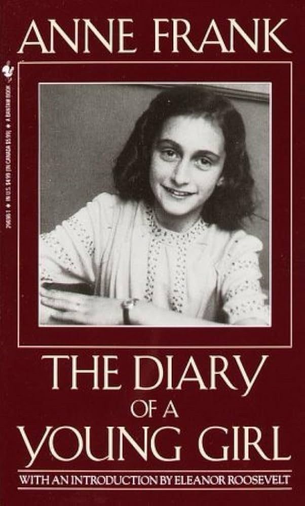 Cover of book “Diary of a Young Girl” by Anne Frank- original version in maroon with Anne Frank’s portrait in center