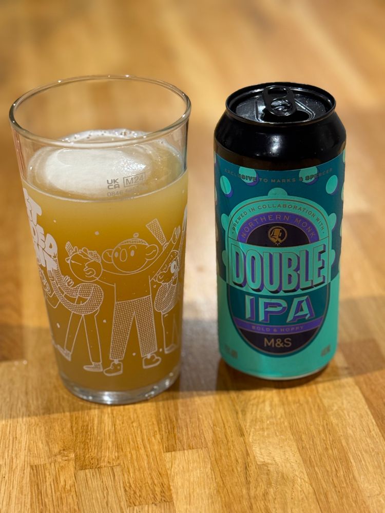 A glass of M&S Northern Monk Double IPA next to its can