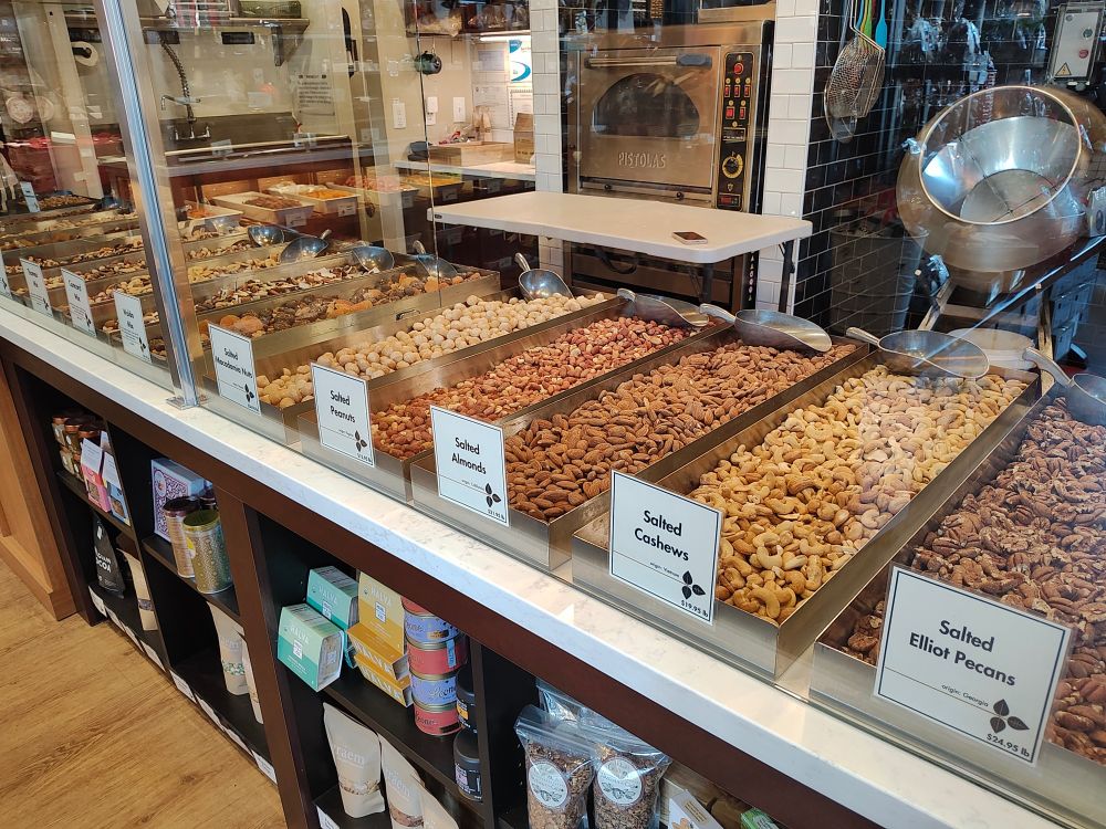 Bins of nuts for sale.