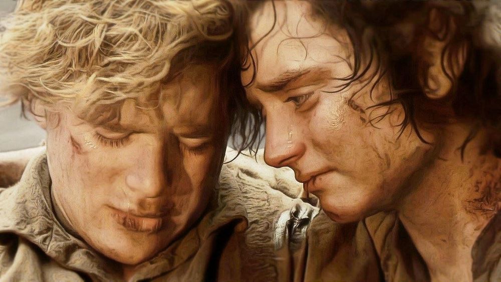 Screenshot de Sam et Frodo s’enlaçant près du Mont Destin, ils ont l'air épuisés, tristes et sont marqués physiquement par la douleur et l'épuisement