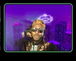 Black man in Kufi and dashiki