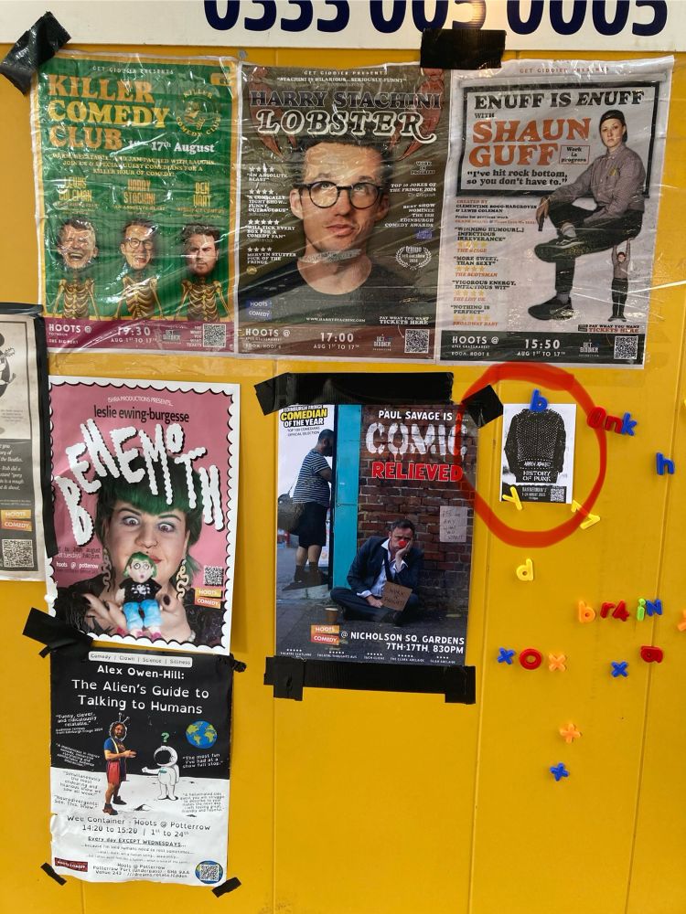 Flyers on a wall at the Edinburgh Fringe. Circles is Andrew O’Neill’s History of Punk.