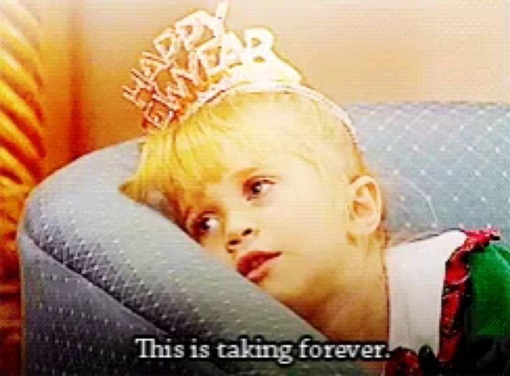 a little girl wearing a happy new year tiara