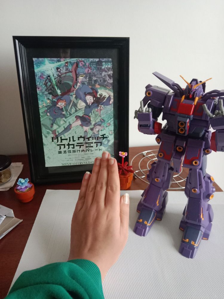 Psycho gundam gunpla next to my small hand and a little witch academia frame