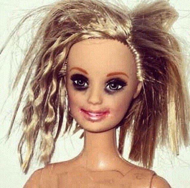 A Barbie with messy hair and smudged make-up 