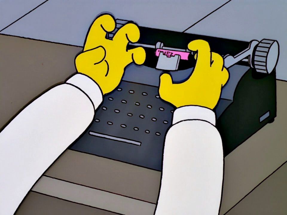 A close-up of yellow hands typing on an old-fashioned typewriter, with a pink piece of paper being inserted.