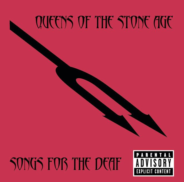 Album cover for 'Songs for the Deaf' by Queens of the Stone Age. The background is a deep red with a minimalist black pitchfork graphic tilted diagonally. The band name is written in gothic-style uppercase letters at the top, and the album title appears at the bottom in the same font. A 'Parental Advisory: Explicit Content' label is positioned in the bottom-right corner.