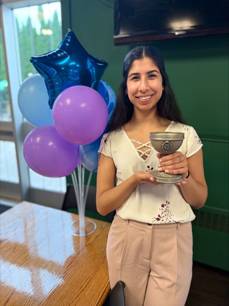 Samina Panjwani holds up a goblet.