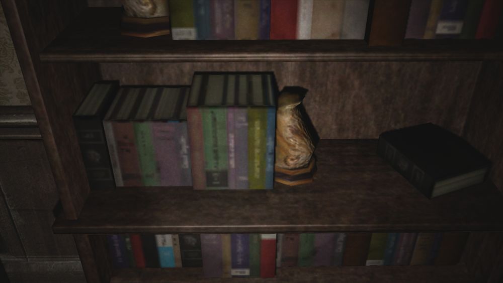 Picture of the same stack of books texture as the Silent Hill Wiki screenshot, but from the Xbox 360 version, and as close as the game's camera allows you to look at said texture, showing it's illegible in this version