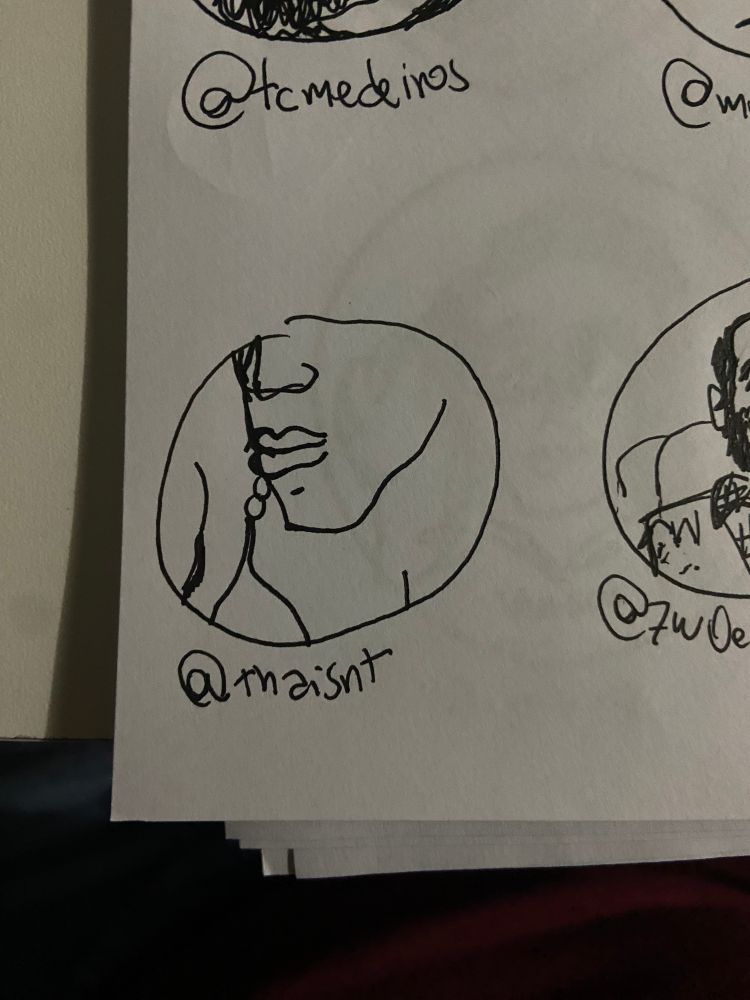 desenho feito a mão com caneta preta em folha branca do rosto da foto de perfil da @ marcada dentro de um círculo 