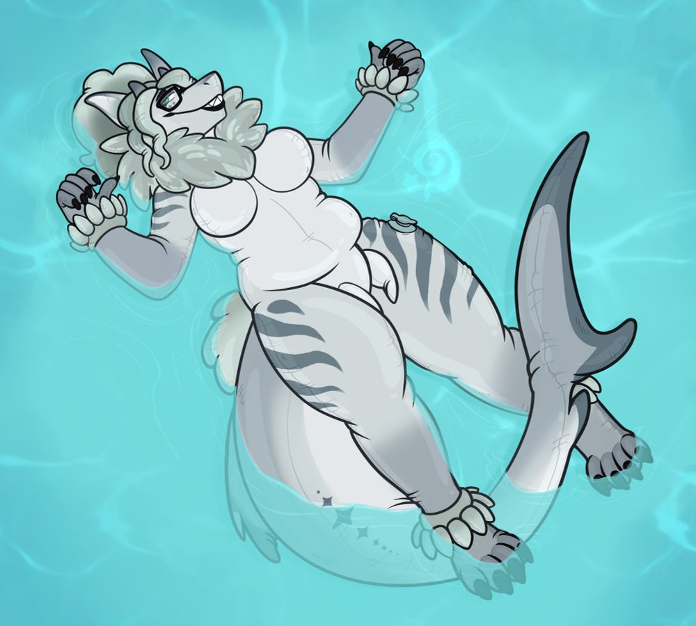 T’Sara the inflatable shark floating nude in the pool. 