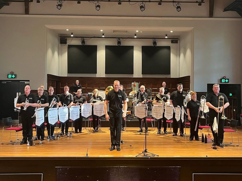 View from the audience at the tutors concert. We’re stood for the final applause. There are three cornet tutors, one flugel, one tenor horn, one euphonium, one baritone, two trombones, two basses, and three percussion