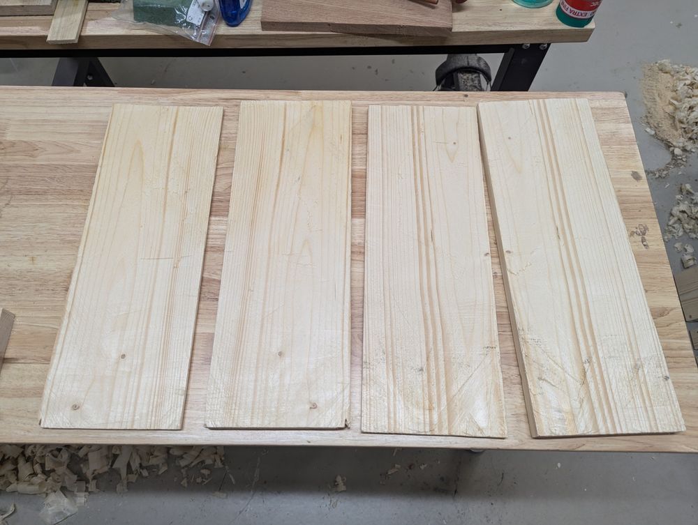 Four planks of spruce that are the result of resawing two blanks of spruce along their thickness.