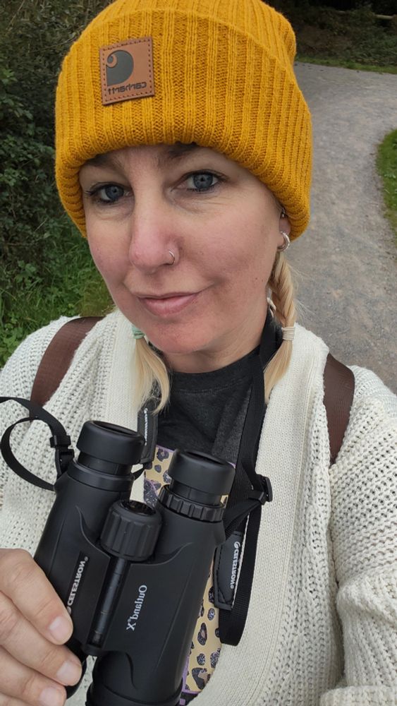 Me in a woolly hat, and binoculars round my neck 