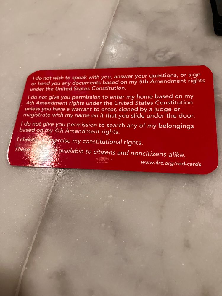 Your immigration rights in English on a red water proof card. 