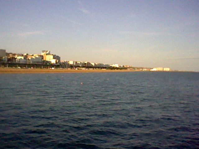 The sea and Brighton in the distance, shot from the pier
