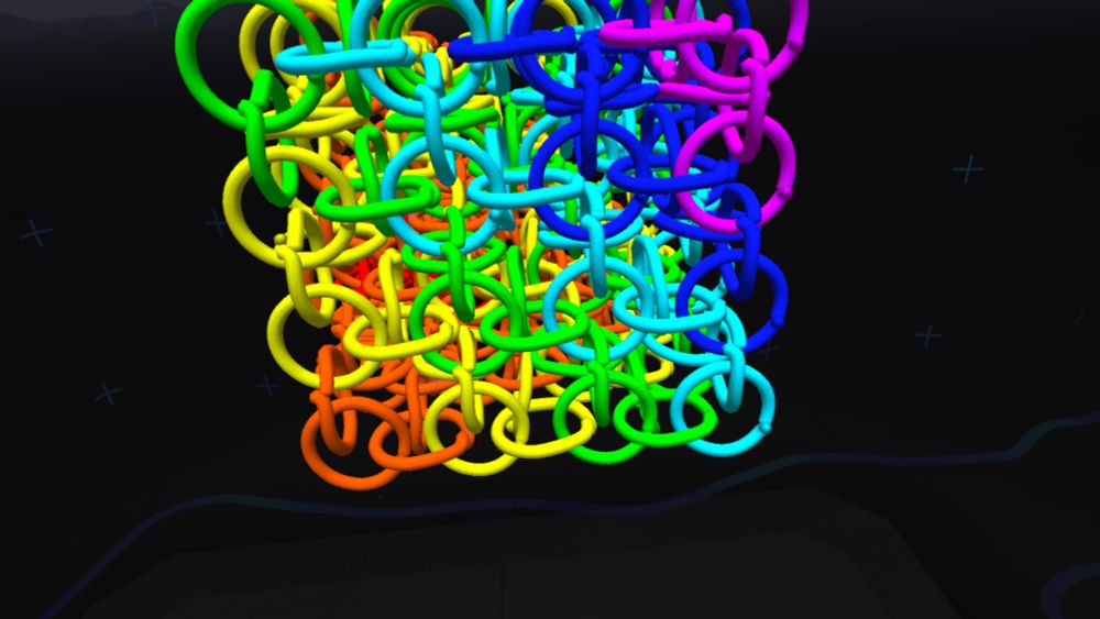 A side view of a 3D paint representation of a rainbow jelly cube