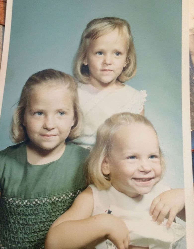 3 little girls posing for a pic. 